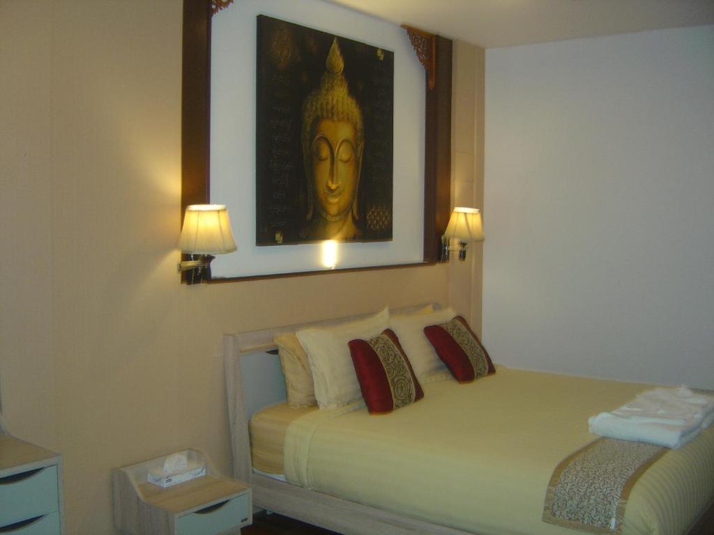 Postel nebo postele na pokoji v ubytování QG Resort