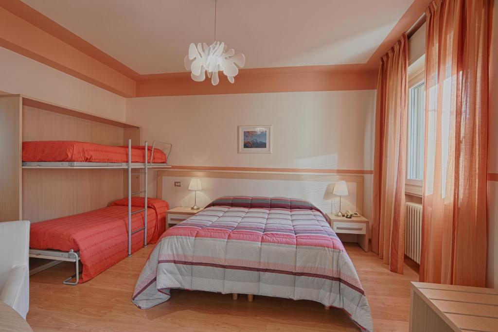 Postel nebo postele na pokoji v ubytování Hotel Europa - Sorico