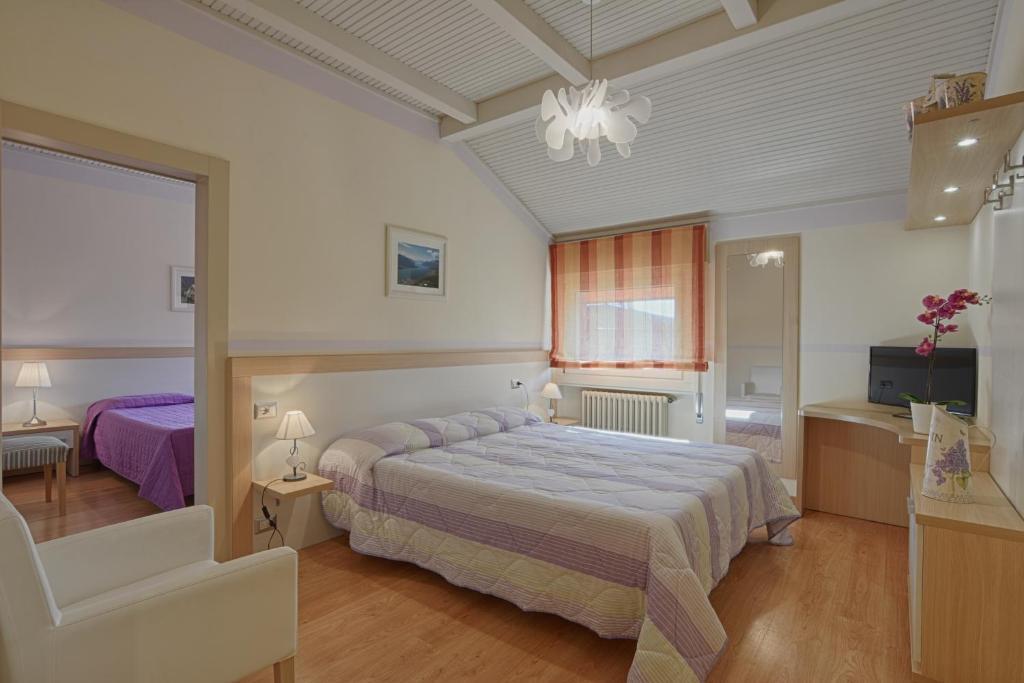 Postel nebo postele na pokoji v ubytování Hotel Europa - Sorico