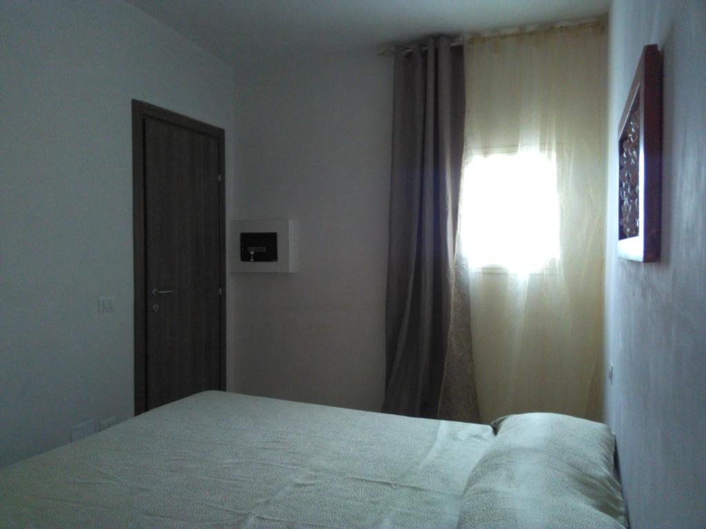 Postel nebo postele na pokoji v ubytování Kimera Beach Apartments