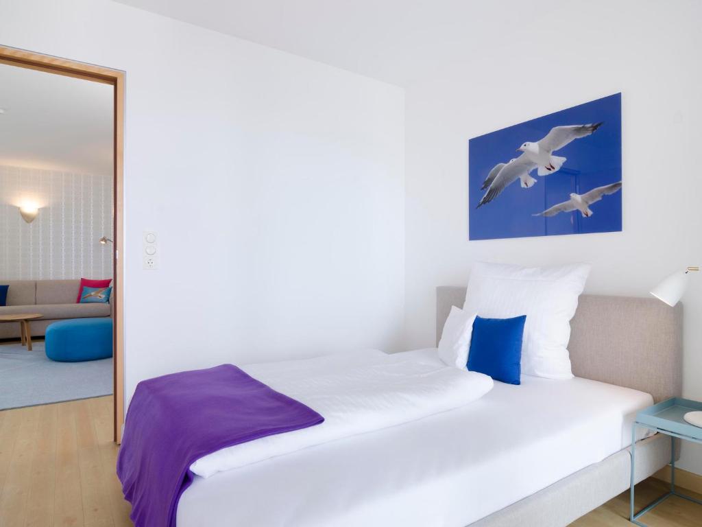 Postel nebo postele na pokoji v ubytování atoll apartments
