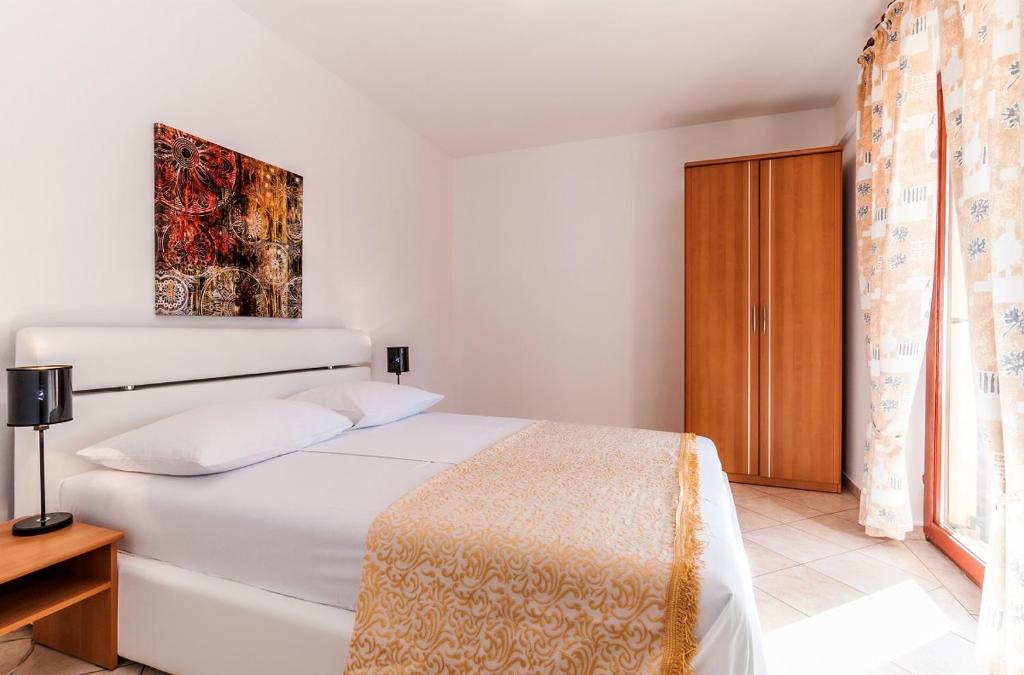 Postel nebo postele na pokoji v ubytování Villa Mare Apartments