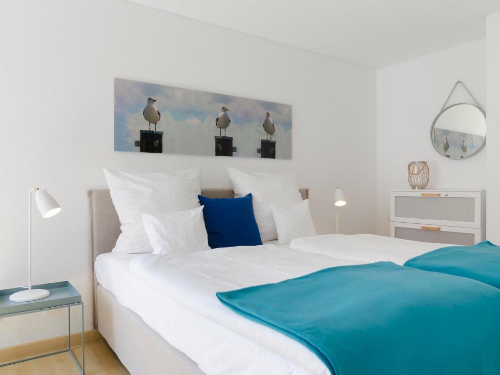 Postel nebo postele na pokoji v ubytování atoll apartments