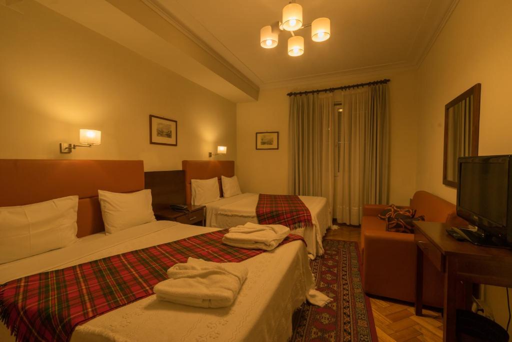 TV a/nebo společenská místnost v ubytování Pao de Acucar Hotel