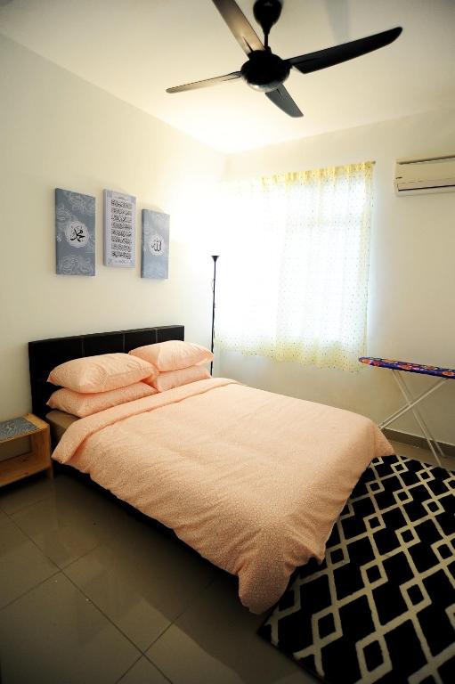 Postel nebo postele na pokoji v ubytování Palm Homestay Dwiputra Putrajaya