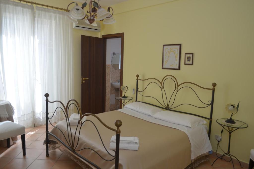 Postel nebo postele na pokoji v ubytování Ansise Guest House