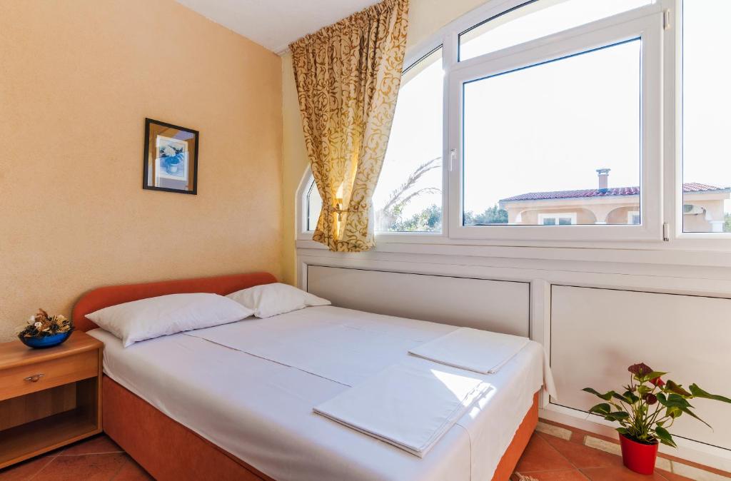 Postel nebo postele na pokoji v ubytování Villa Mare Apartments