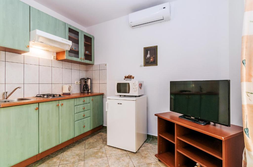 Kuchyň nebo kuchyňský kout v ubytování Villa Mare Apartments