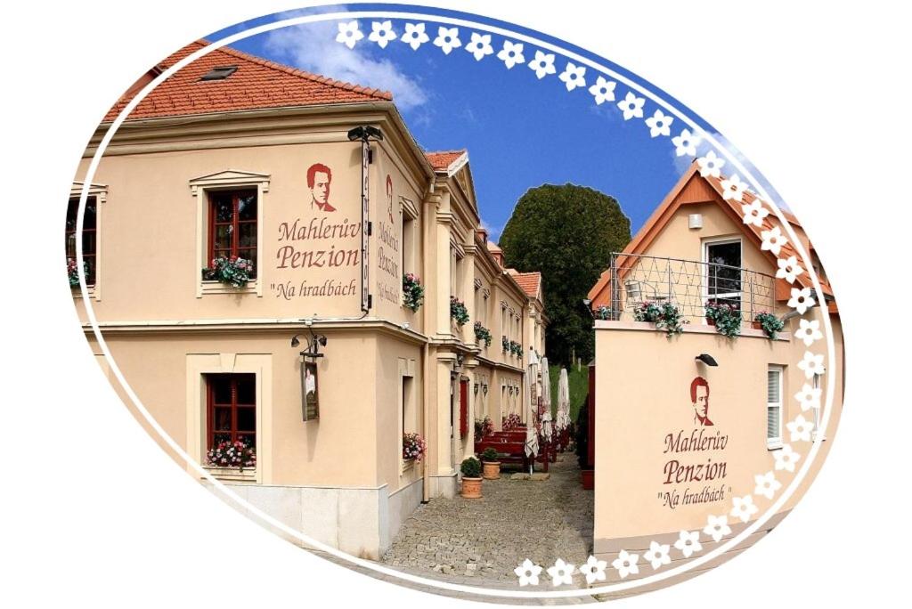 a mirror image of a building in a street at Mahleruv Penzion Na Hradbach in Jihlava