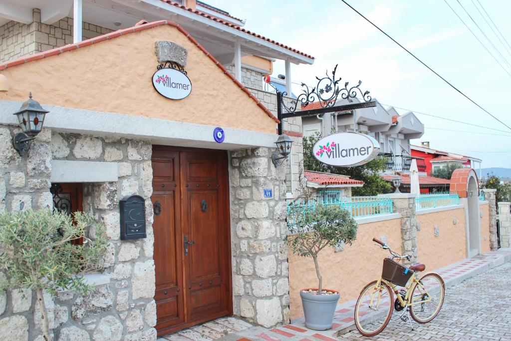 a bike parked in front of a building at Villamer Alaçatı in Alacati