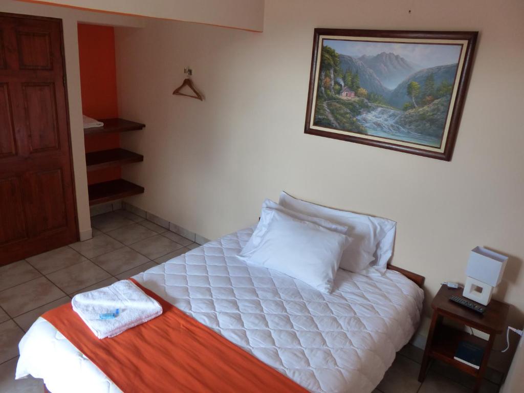 Postel nebo postele na pokoji v ubytování Mountain Faro Hotel