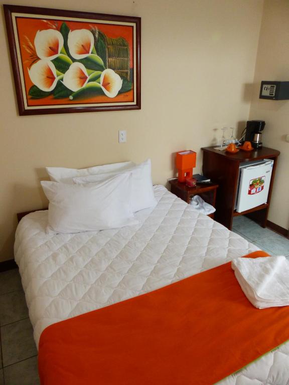 Postel nebo postele na pokoji v ubytování Mountain Faro Hotel