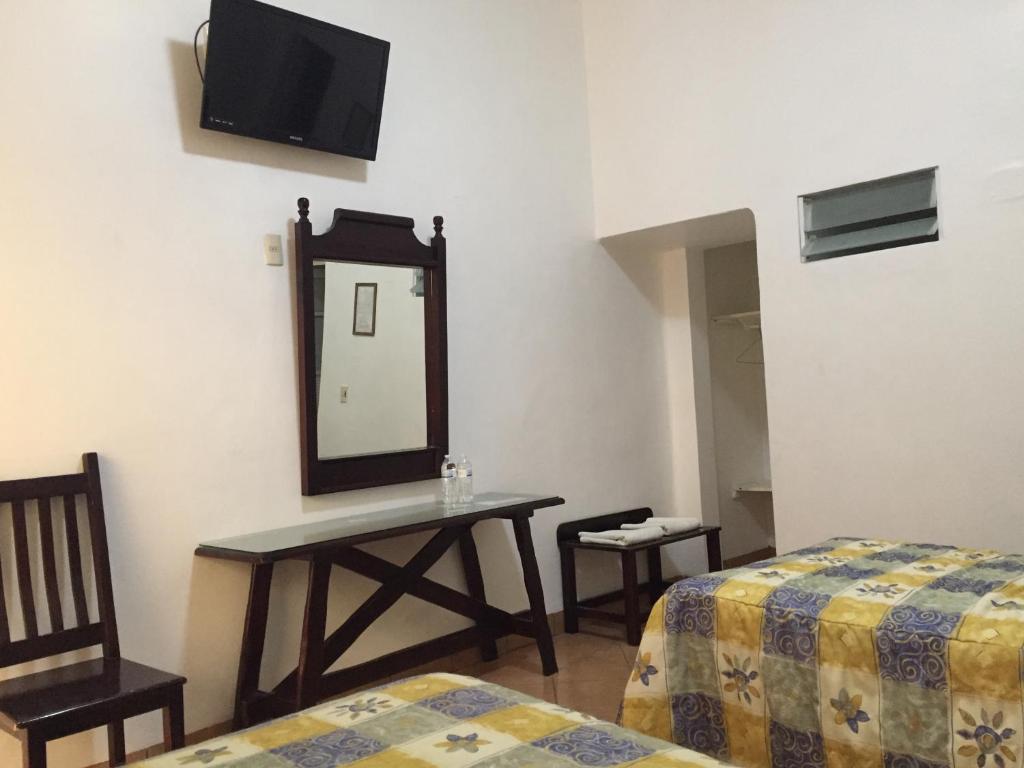 Postel nebo postele na pokoji v ubytování Hotel de los baños