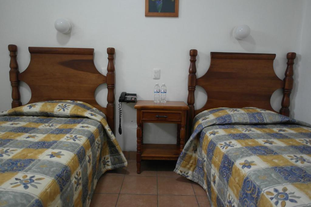 Postel nebo postele na pokoji v ubytování Hotel de los baños