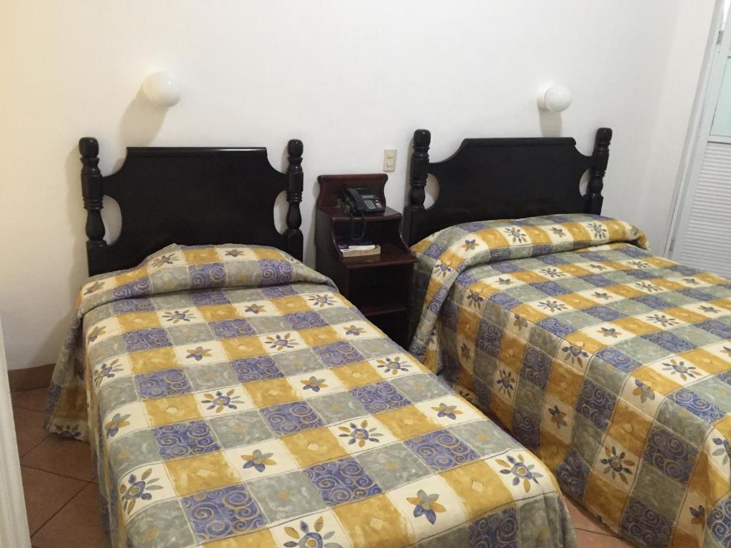 Postel nebo postele na pokoji v ubytování Hotel de los baños
