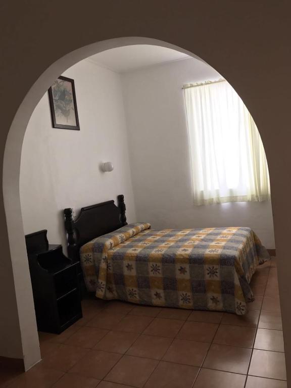Postel nebo postele na pokoji v ubytování Hotel de los baños