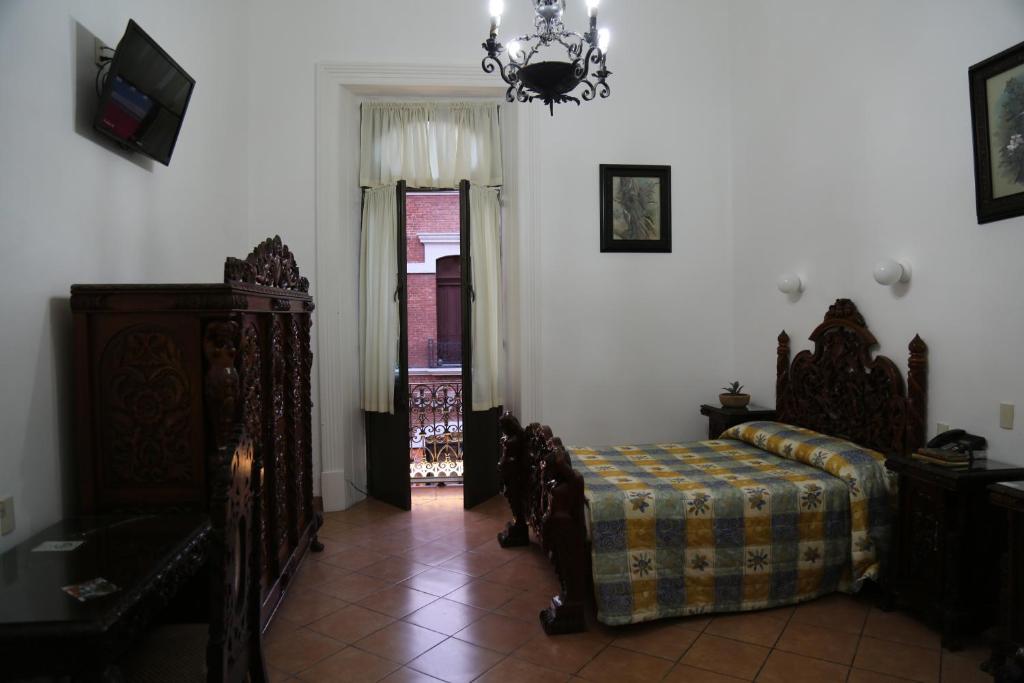 Postel nebo postele na pokoji v ubytování Hotel de los baños