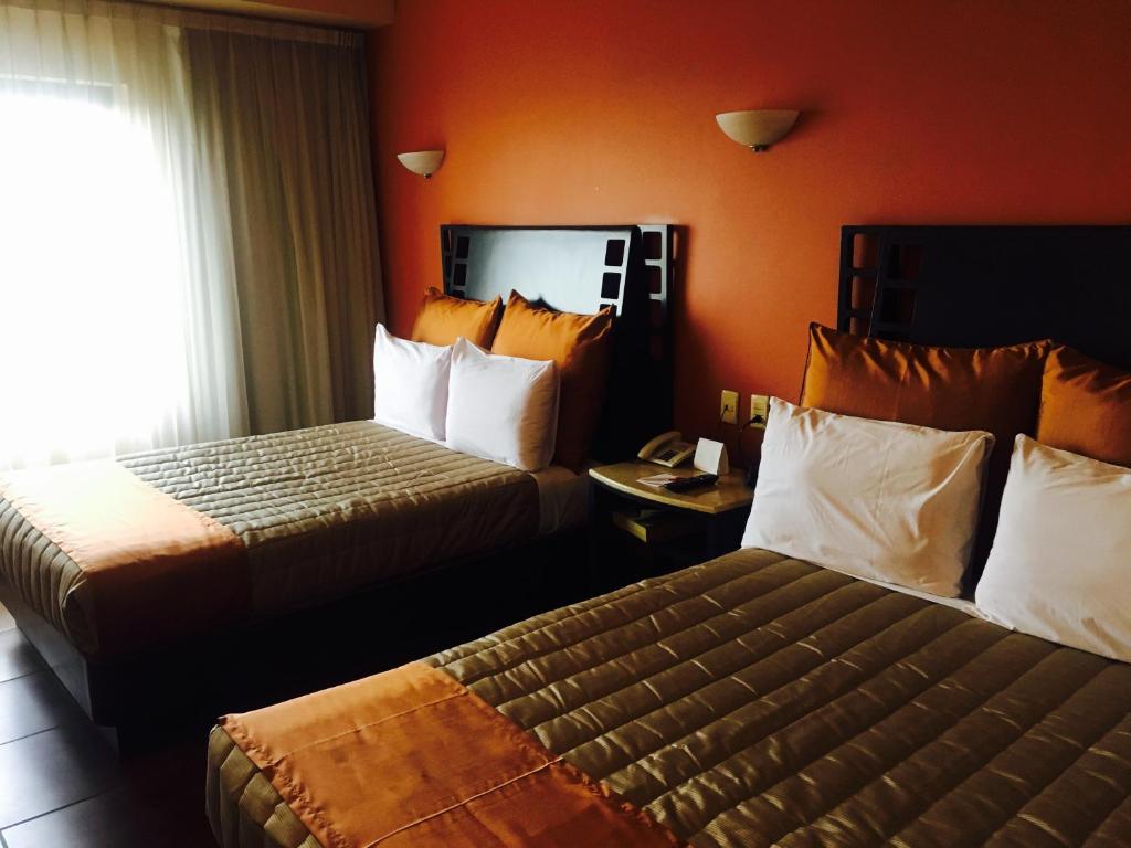 Postel nebo postele na pokoji v ubytování Hotel Celta