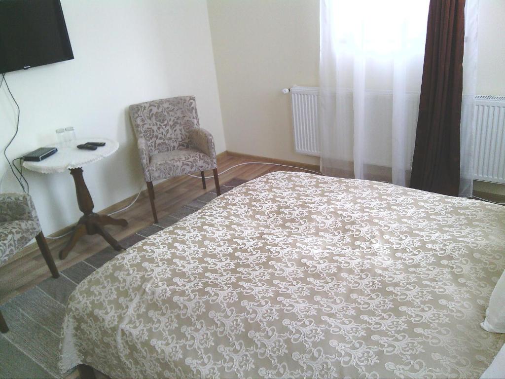 Postel nebo postele na pokoji v ubytování Pension Cetate Valcău de Sus
