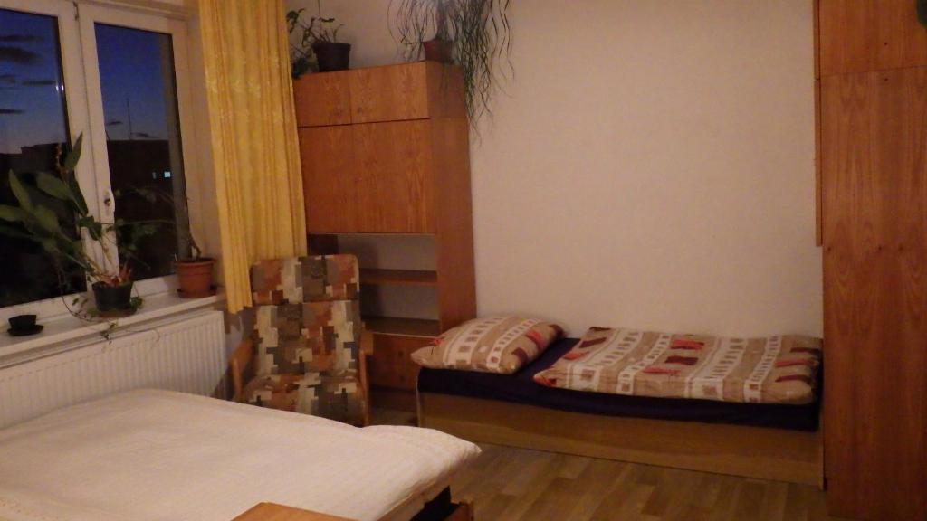 Ein Bett oder Betten in einem Zimmer der Unterkunft Ubytování u Dolanských