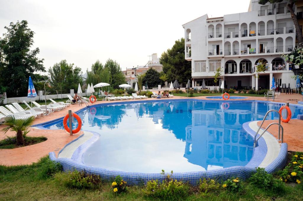 a large swimming pool in front of a building at Hotel Andalucia in Lanjarón