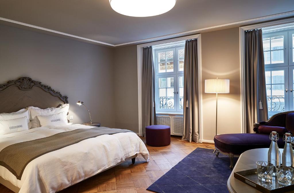 Postel nebo postele na pokoji v ubytování Boutique Hotel La Couronne
