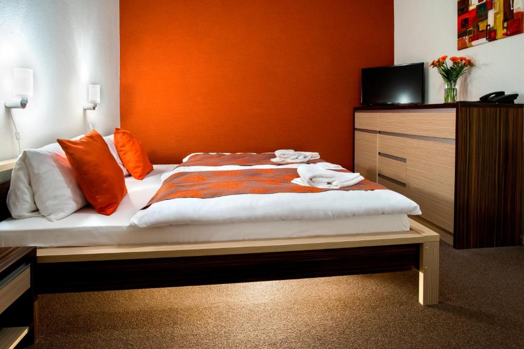 Postel nebo postele na pokoji v ubytování Hotel Bystricka