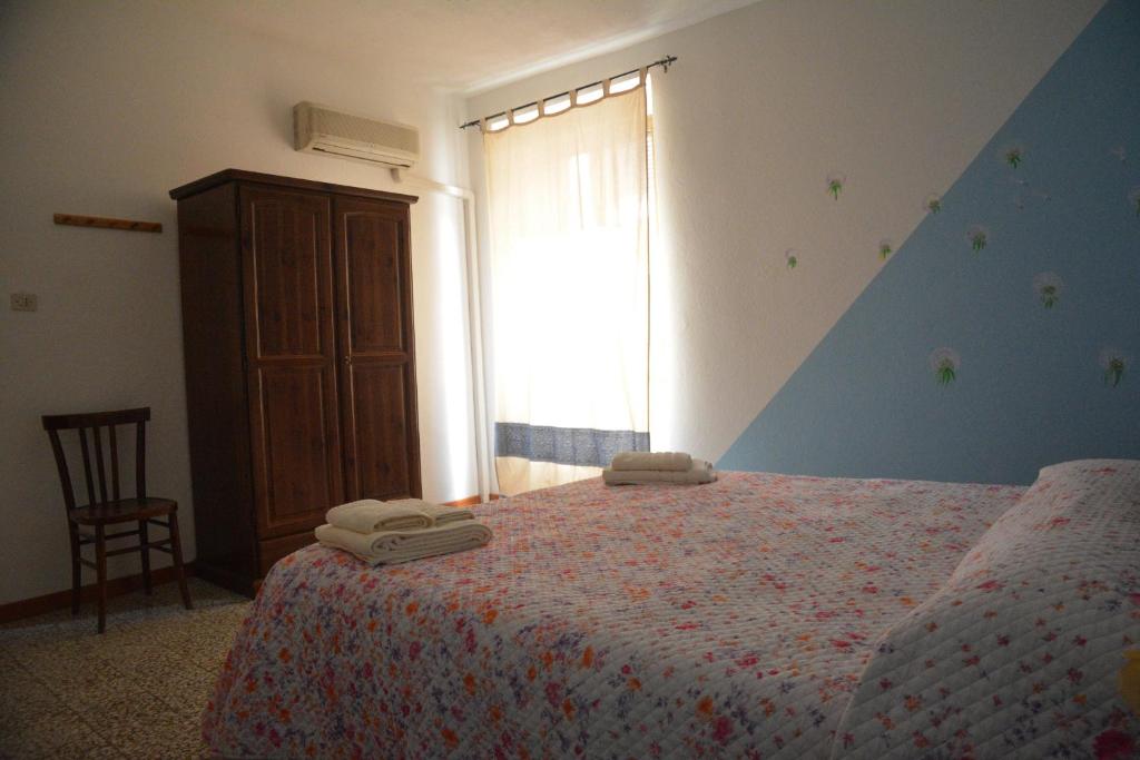 Postel nebo postele na pokoji v ubytování B&B Oasi Tepilora
