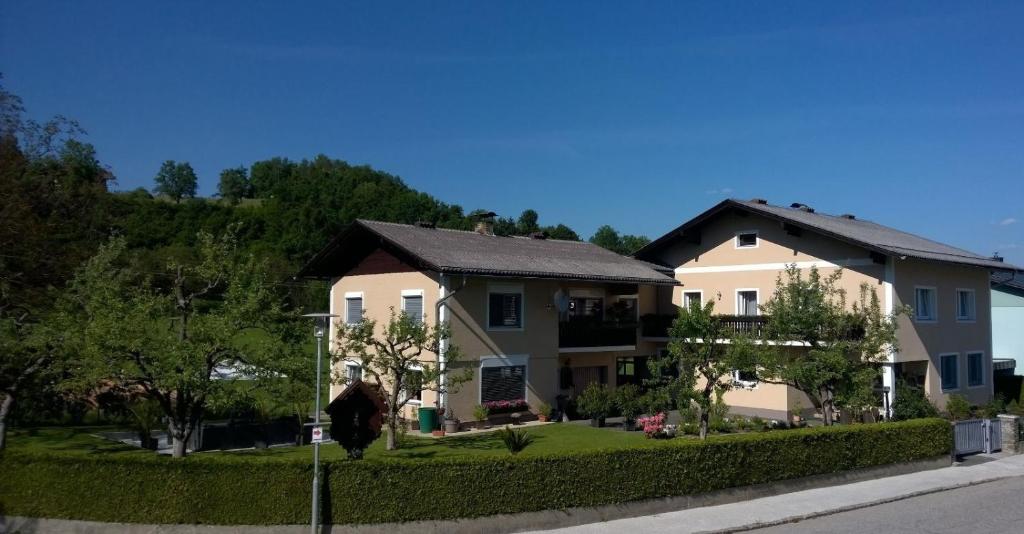 a large house on the side of a street at Gästehaus Rosl in Reifnitz