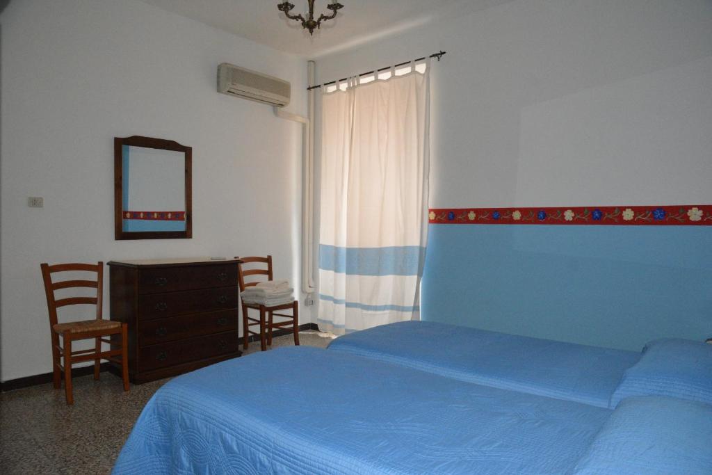 Postel nebo postele na pokoji v ubytování B&B Oasi Tepilora