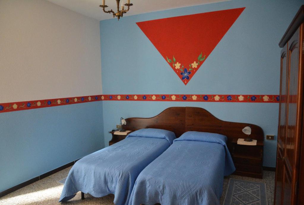 Postel nebo postele na pokoji v ubytování B&B Oasi Tepilora