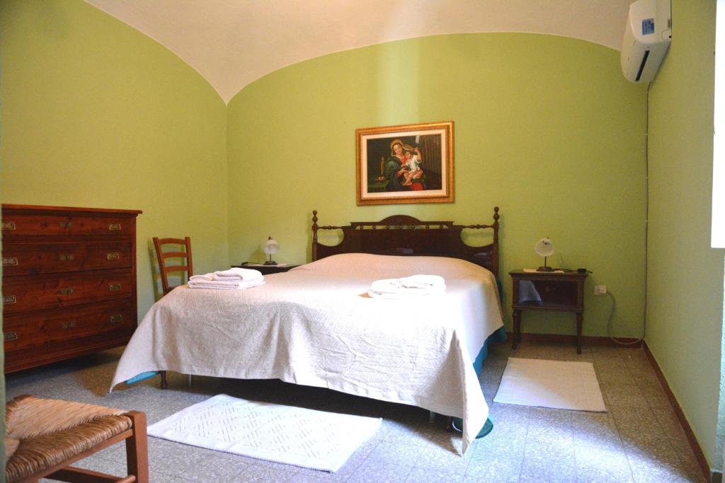 Postel nebo postele na pokoji v ubytování B&B Oasi Tepilora
