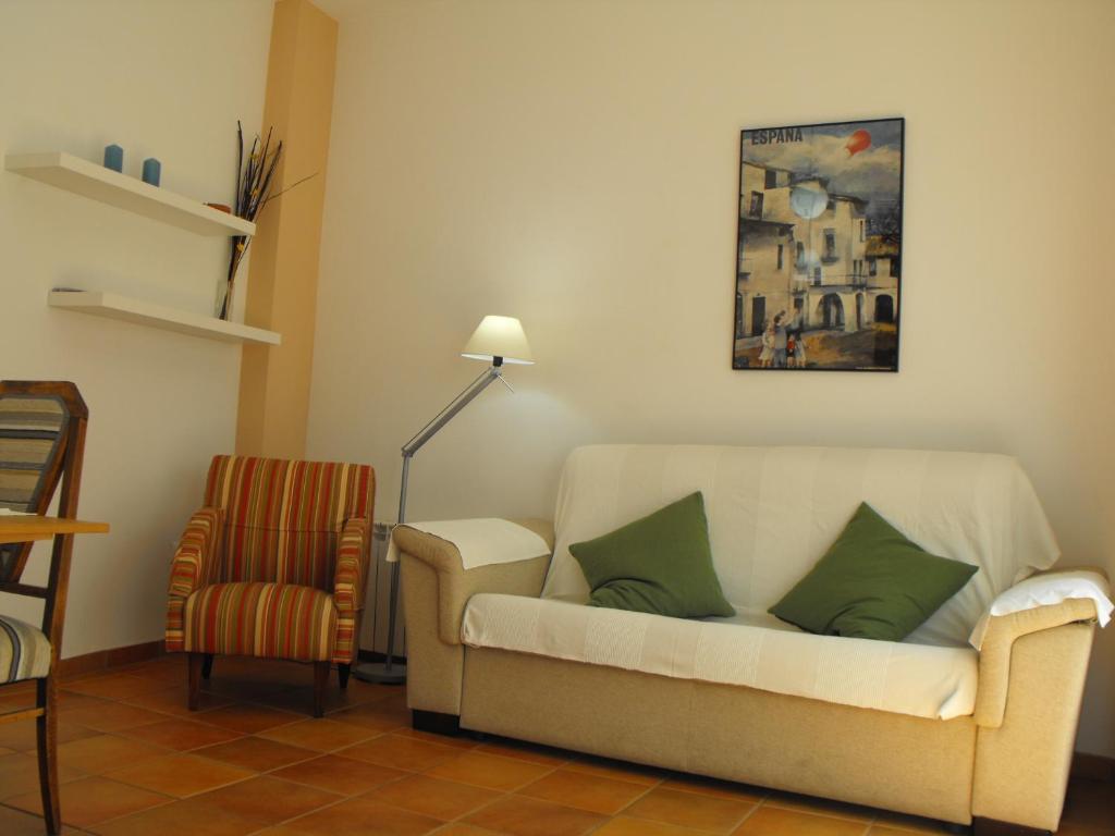 a living room with a couch and a chair at Karmapartment 2 in Seville