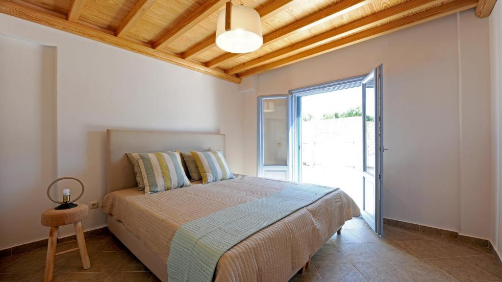 Postel nebo postele na pokoji v ubytování Modus Vivendi Villas