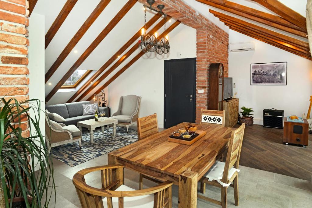 a living room with a wooden table and chairs at Apartment Holiday in Podstrana in Podstrana