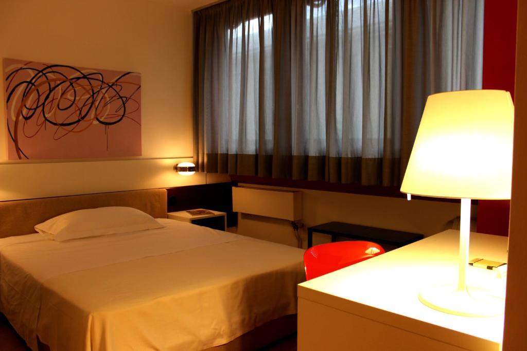 Postel nebo postele na pokoji v ubytování Hotel Garni Centro