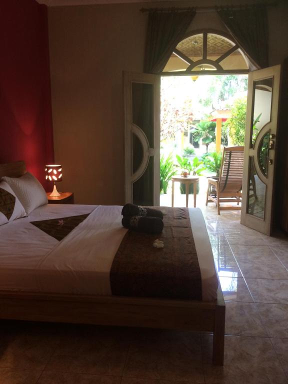 Giường trong phòng chung tại Ada Waktu Homestay