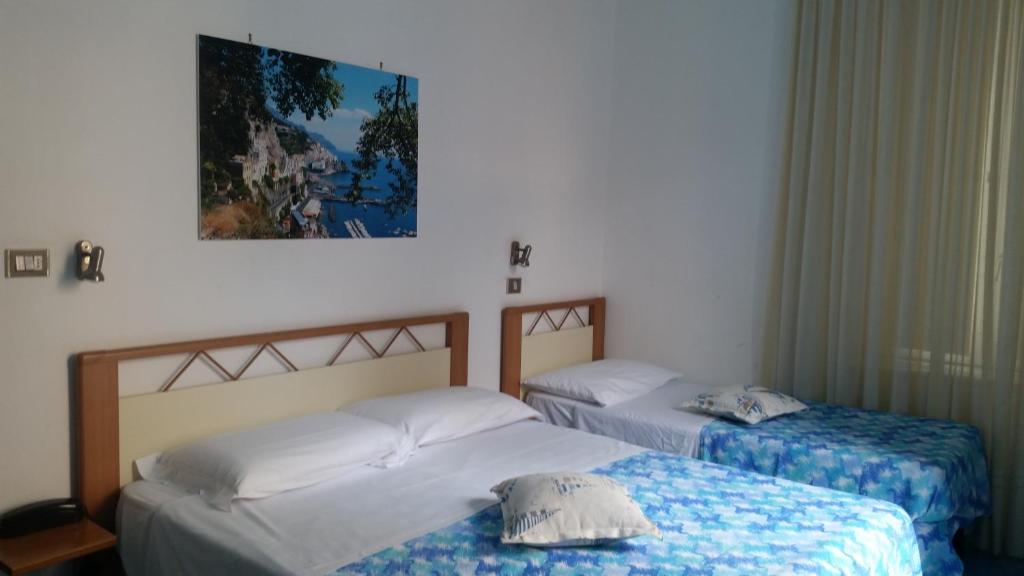 Postel nebo postele na pokoji v ubytování Albergo S. Andrea