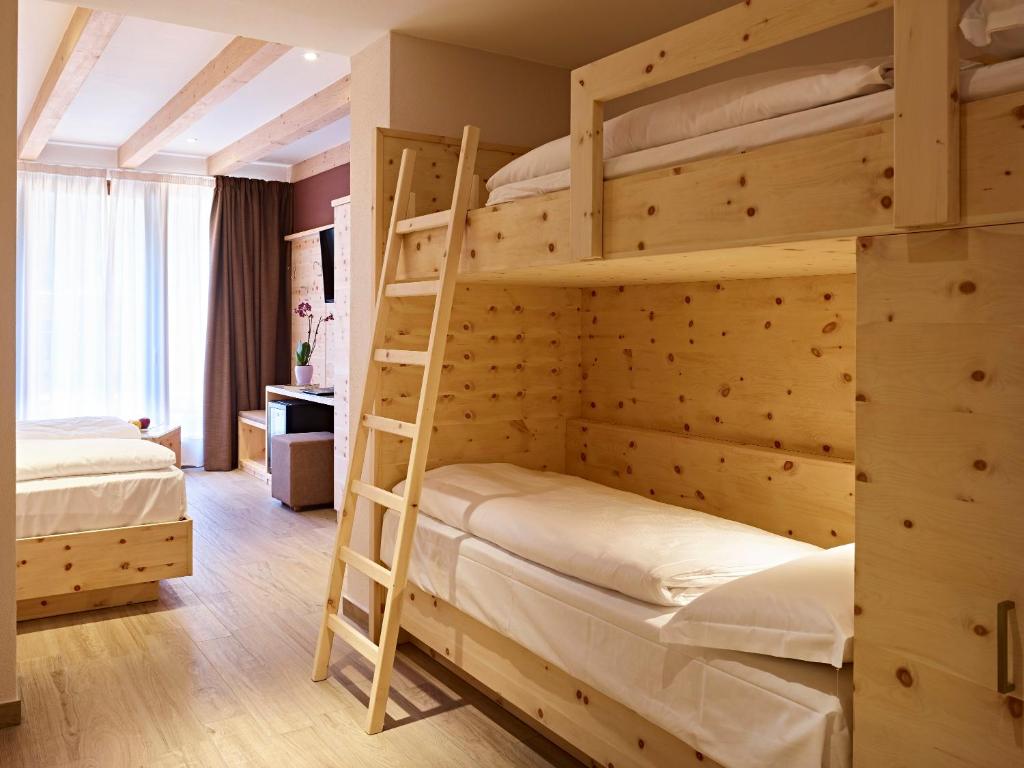 Postel nebo postele na pokoji v ubytování Hotel Garni My Ledro