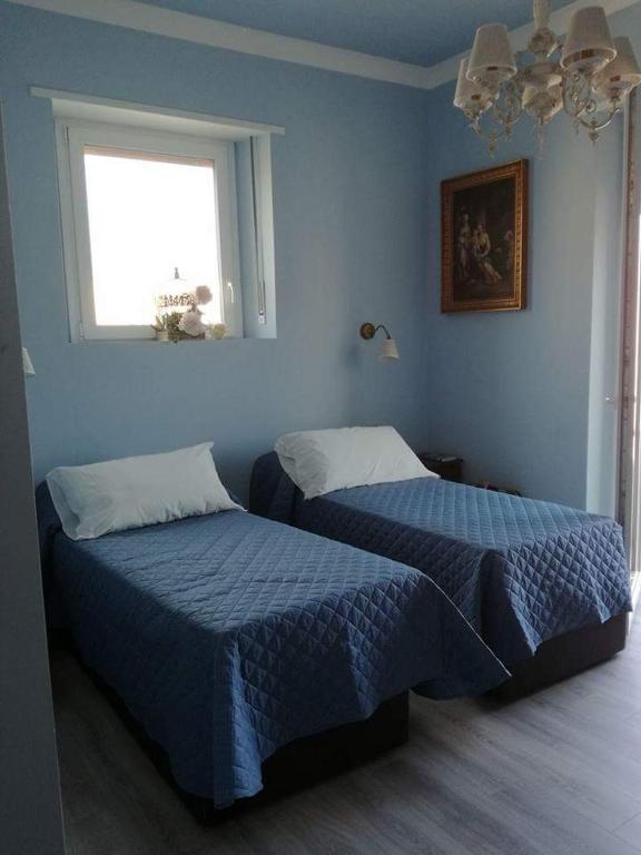 A bed or beds in a room at Casa Garibaldi