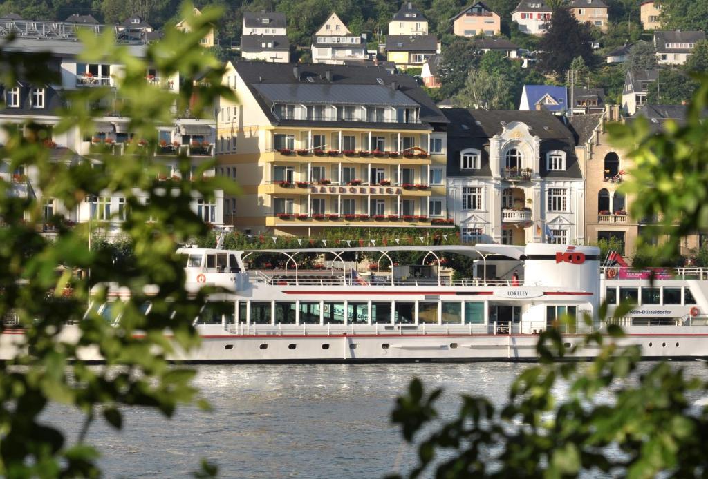 a large boat on the water in front of a building at Baudobriga Rheinhotel in Boppard
