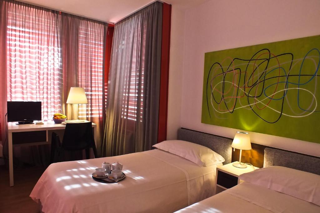 Postel nebo postele na pokoji v ubytování Hotel Garni Centro