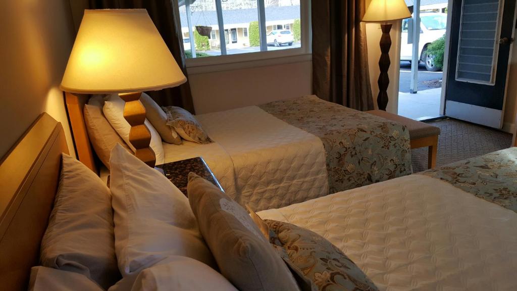 Postel nebo postele na pokoji v ubytování Starlight Lodge Cape Cod