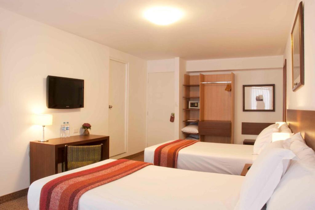 Cama ou camas em um quarto em Tierra Viva Arequipa Plaza