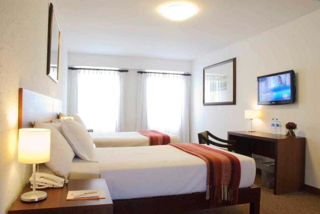 Cama ou camas em um quarto em Tierra Viva Arequipa Plaza