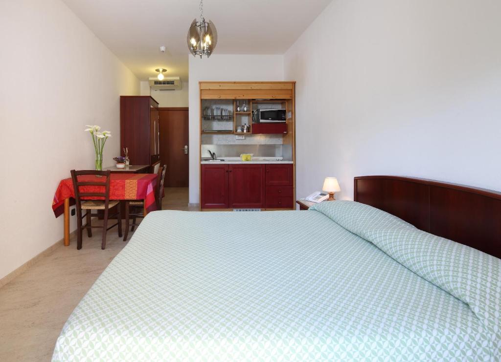 Voodi või voodid majutusasutuse Residence Hotel Kriss toas