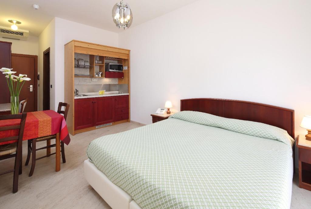 Voodi või voodid majutusasutuse Residence Hotel Kriss toas