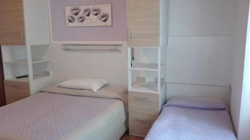 Postel nebo postele na pokoji v ubytování Hotel Belfort
