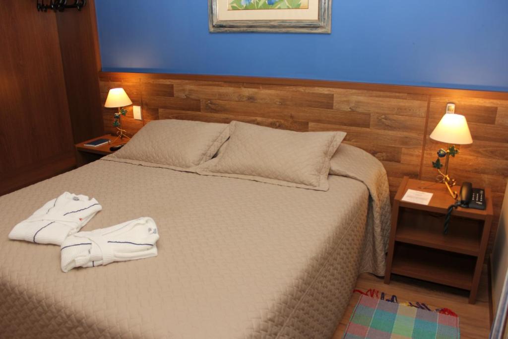 A bed or beds in a room at Thermas Park Resort & SPA by Hot Beach