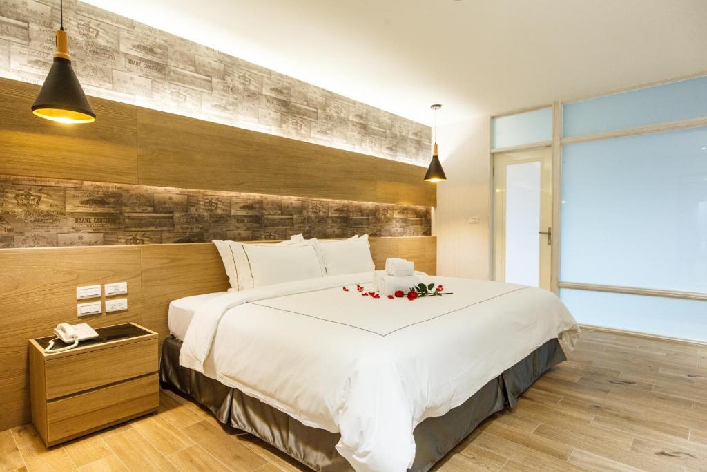 Postel nebo postele na pokoji v ubytování Da Pu Hotspring Hotel